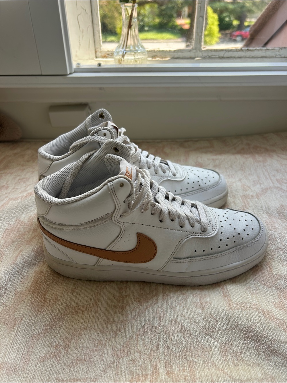 Nike women’s  White High-Top Sneakers with Brown Swoosh